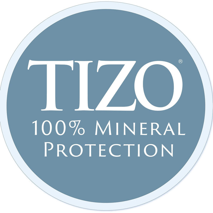 Collection of TiZO skincare and sun protection products including serums, moisturizers, primers, and sunscreens