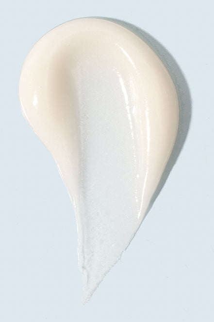 Close-up of TiZO AM Rejuvenation cream showing smooth, lightweight texture for easy application
