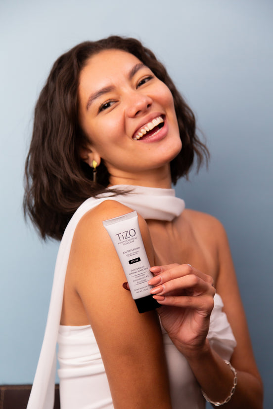 TiZO AM Replenish Lightly Tinted SPF 40 in tube packaging for easy morning skincare application
