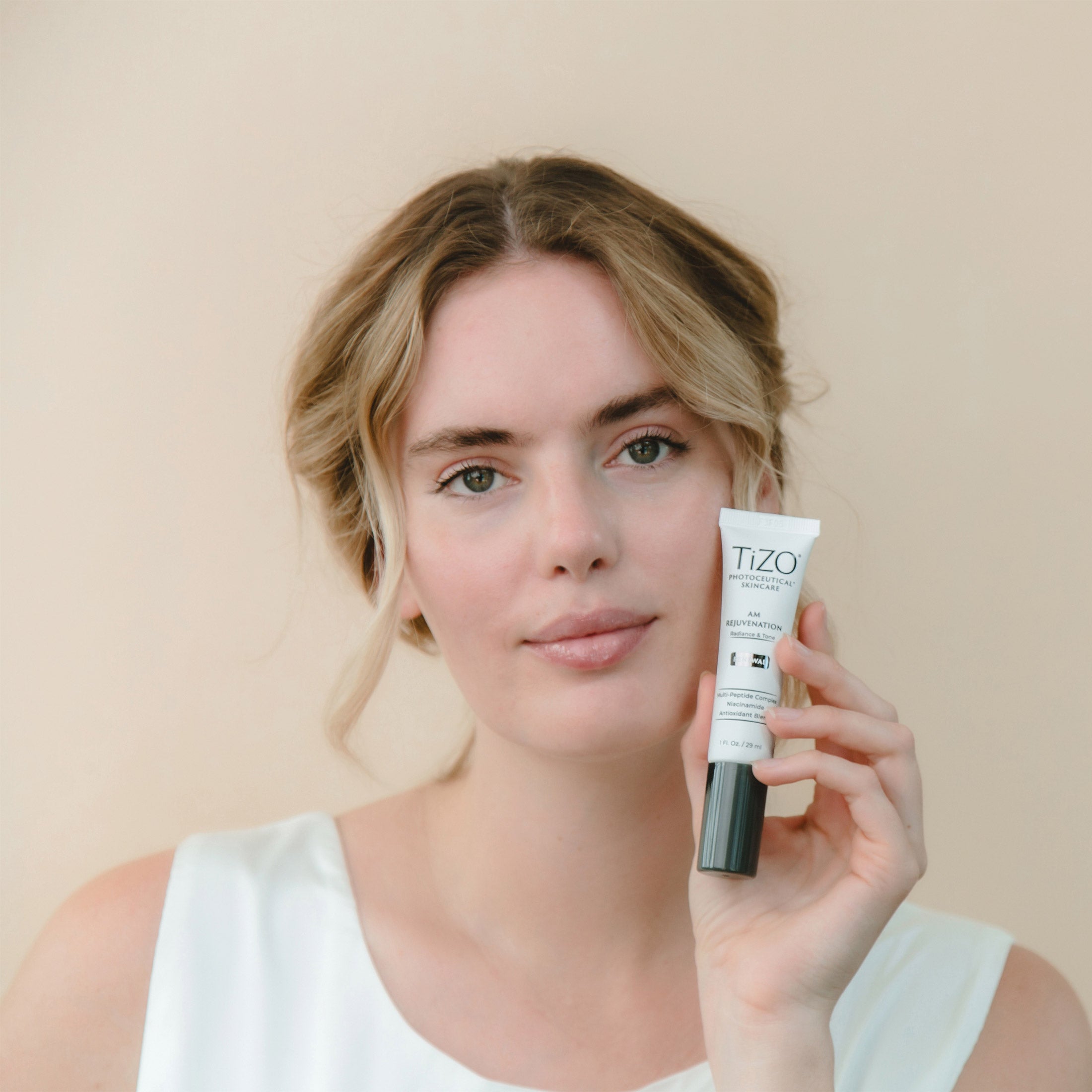 Close-up of TiZO AM Rejuvenation cream showing smooth, lightweight texture for easy application
